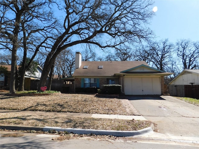 ranch-style home with brick siding, driveway, a chimney, and fence