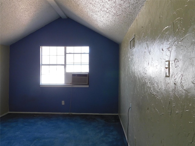 empty room with lofted ceiling, visible vents, carpet flooring, and a textured ceiling