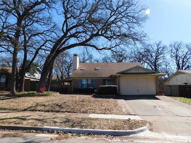 single story home featuring concrete driveway, brick siding, a chimney, and fence