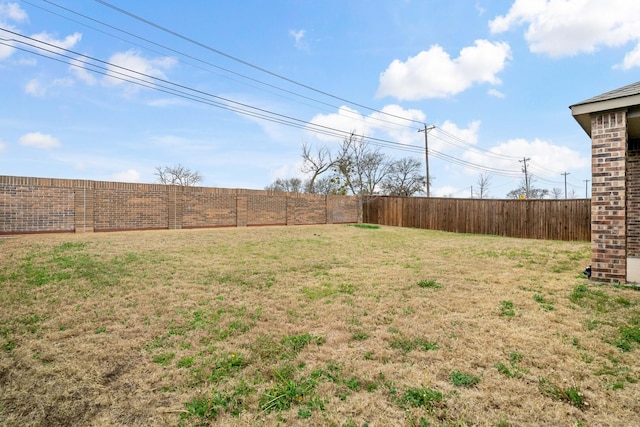 view of yard featuring a fenced backyard