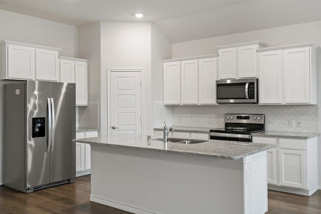 kitchen with a center island with sink, white cabinetry, stainless steel appliances, and a sink