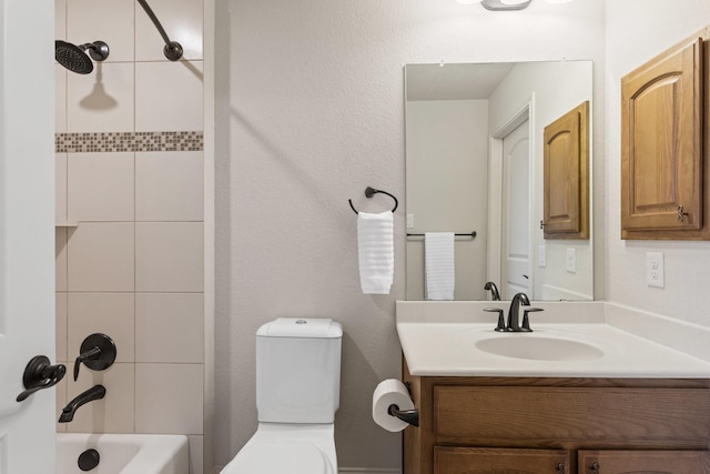 full bath with bathtub / shower combination, vanity, and toilet