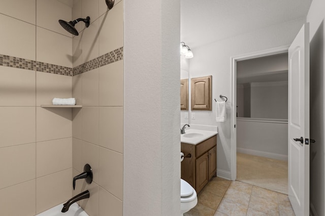 bathroom with shower / bathtub combination, tile patterned floors, and vanity