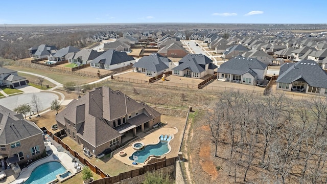 birds eye view of property with a residential view