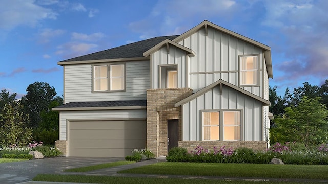 view of front of house featuring a garage, a shingled roof, driveway, stone siding, and board and batten siding