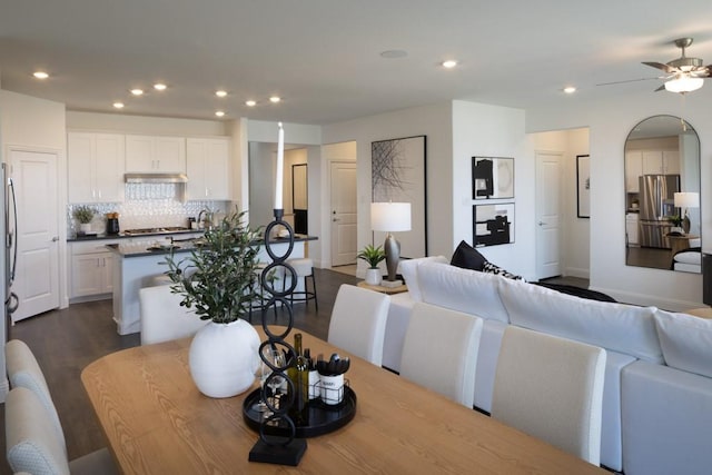 dining room featuring dark wood-type flooring, recessed lighting, and a ceiling fan