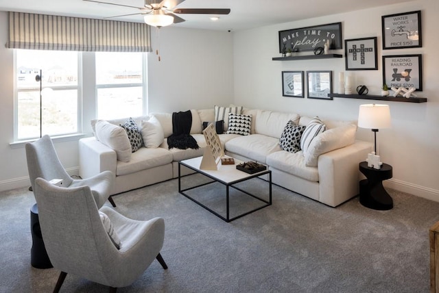 living room with carpet, ceiling fan, and baseboards