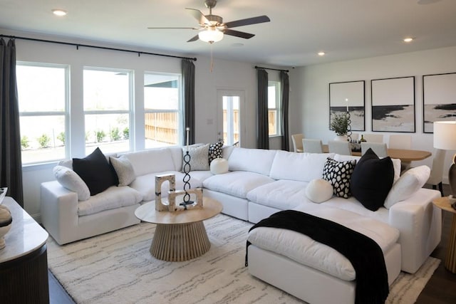 living area with a ceiling fan and recessed lighting