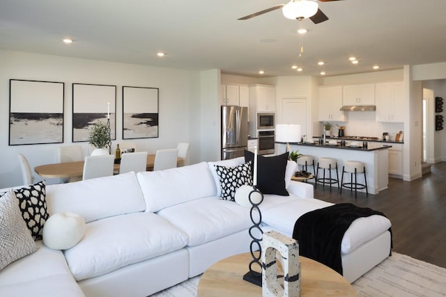 living room featuring ceiling fan, wood finished floors, and recessed lighting