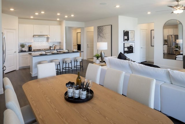 dining room featuring dark wood-style floors, recessed lighting, and a ceiling fan