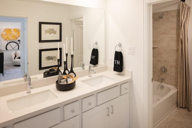 full bath featuring double vanity, shower / tub combo, tile patterned flooring, and a sink