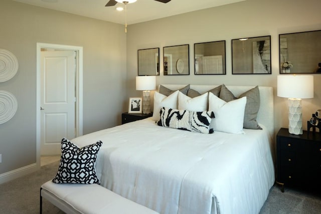 carpeted bedroom with ceiling fan and baseboards