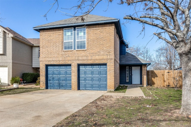 traditional-style house featuring a garage, concrete driveway, brick siding, and fence