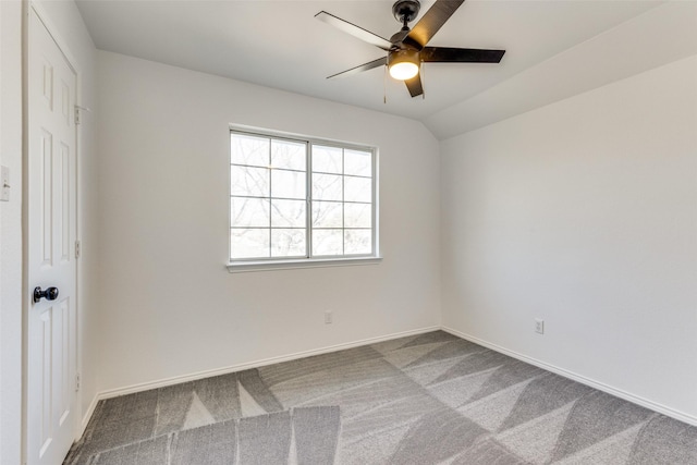 unfurnished room with lofted ceiling, a ceiling fan, baseboards, and carpet flooring