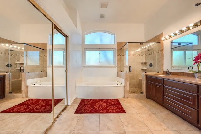 bathroom featuring a garden tub, visible vents, a stall shower, vanity, and tile patterned flooring