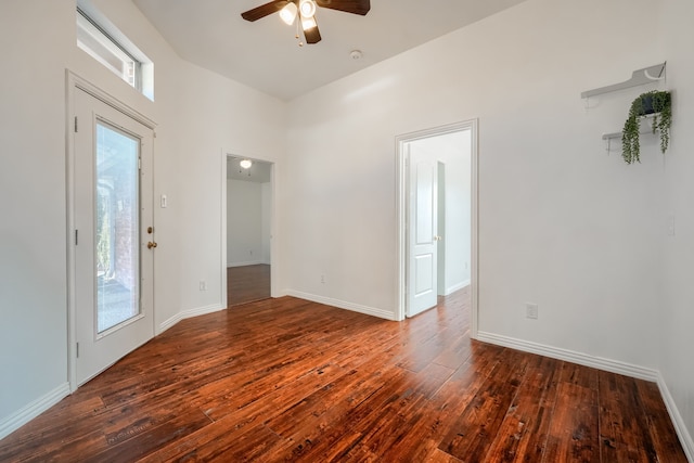 unfurnished room with ceiling fan, baseboards, and hardwood / wood-style flooring