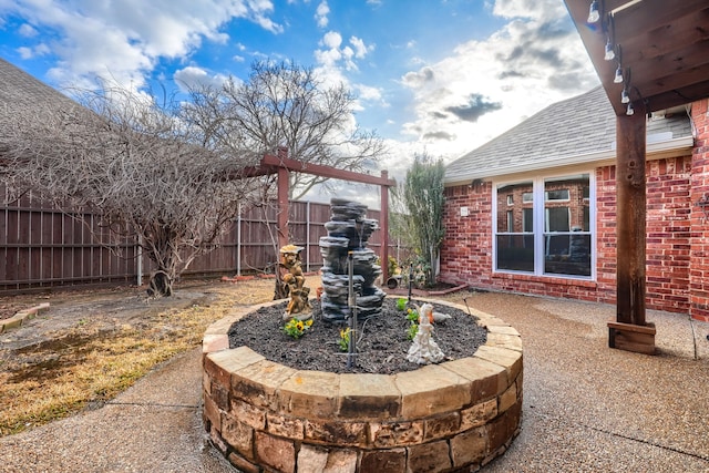 view of patio / terrace with fence