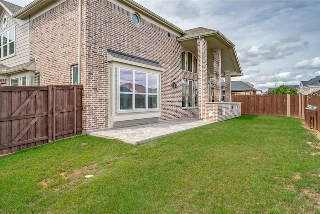 513 Yarrow St, Little Elm, TX 75068 - rear view of house with brick siding and a patio