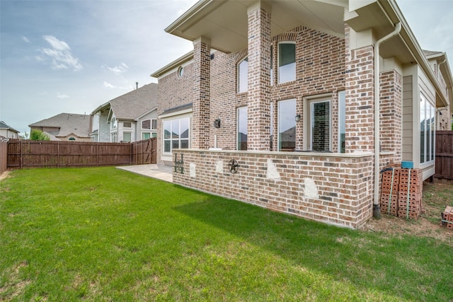 513 Yarrow St, Little Elm, TX 75068 - back of house featuring brick siding