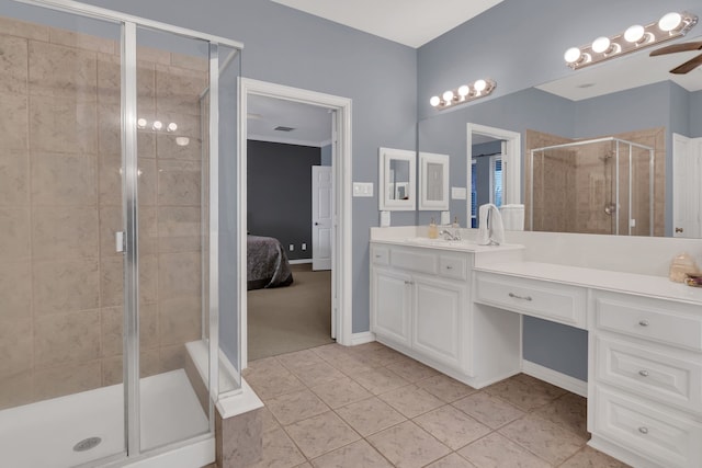 ensuite bathroom featuring vanity, tile patterned flooring, ensuite bath, a ceiling fan, and a shower stall