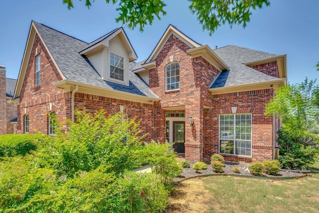 1661 Terrace Dr, Lantana, TX 76226 - traditional-style home featuring a shingled roof and brick siding