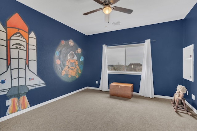 living area featuring a ceiling fan, baseboards, carpet, and visible vents