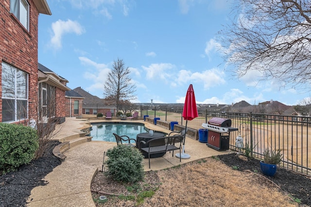view of pool featuring a fenced backyard, a grill, a fenced in pool, and a patio