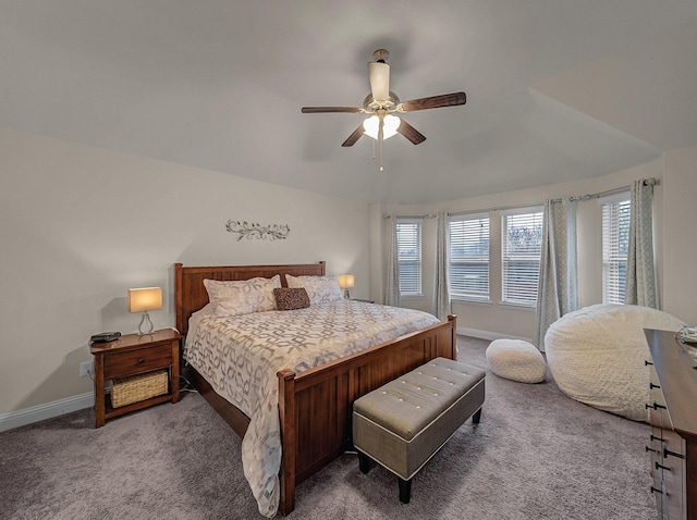 carpeted bedroom featuring baseboards and a ceiling fan