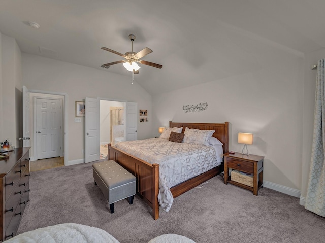 bedroom with connected bathroom, lofted ceiling, carpet, and baseboards