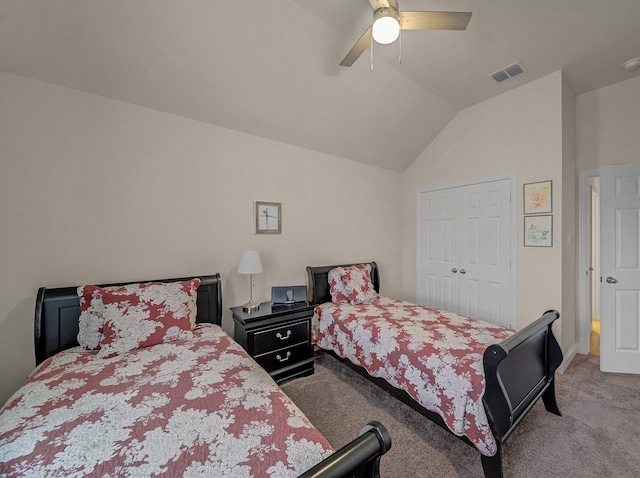 bedroom with vaulted ceiling, carpet flooring, visible vents, and ceiling fan