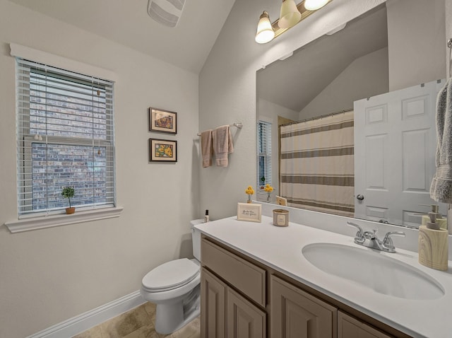 bathroom featuring vanity, a shower with curtain, baseboards, vaulted ceiling, and toilet