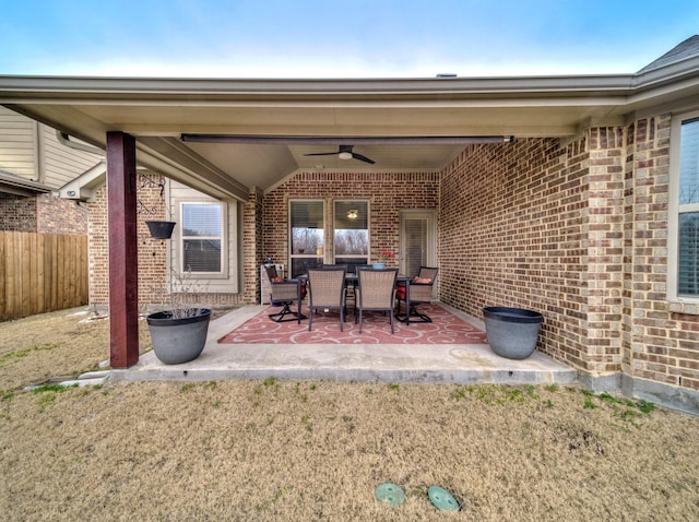 view of patio / terrace featuring ceiling fan and fence