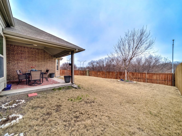 view of yard with a patio and a fenced backyard