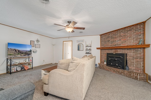 carpeted living room with a wood stove, ceiling fan, visible vents, and a textured ceiling