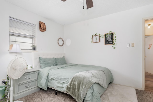 carpeted bedroom with a ceiling fan