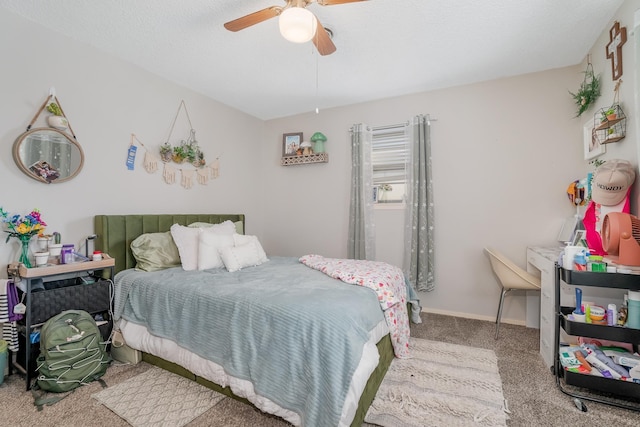 bedroom with ceiling fan, carpet floors, a textured ceiling, and baseboards