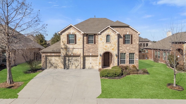 view of front facade with stone siding, a shingled roof, a front yard, and driveway