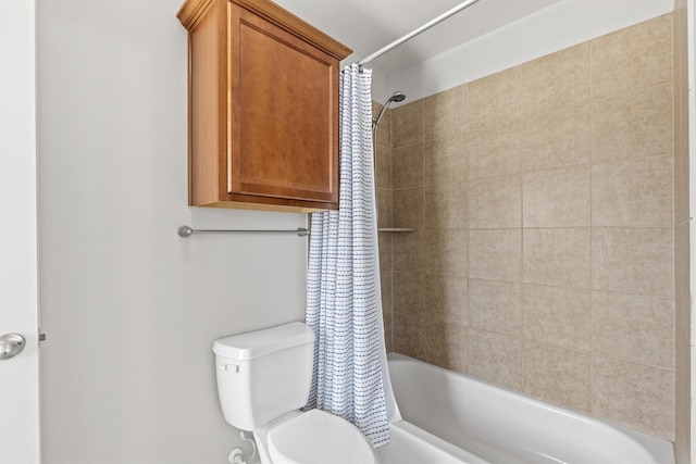 full bath featuring toilet and shower / tub combo with curtain