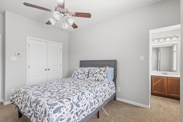 bedroom featuring carpet, baseboards, ceiling fan, and a closet