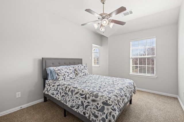 bedroom featuring baseboards, visible vents, ceiling fan, and carpet flooring