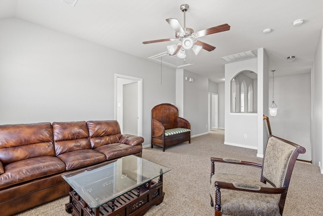 living area featuring visible vents, carpet floors, attic access, and baseboards