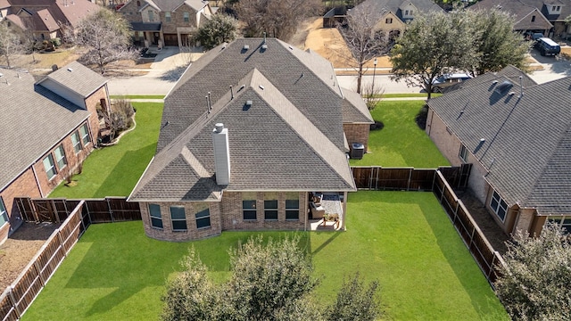 birds eye view of property with a residential view