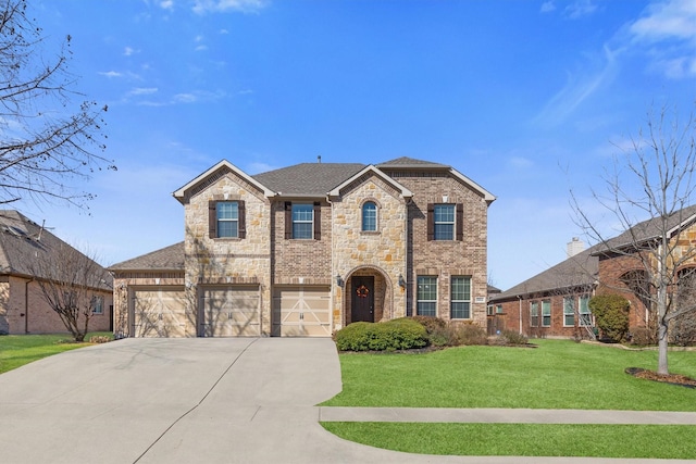 traditional-style house featuring brick siding, an attached garage, a front yard, stone siding, and driveway