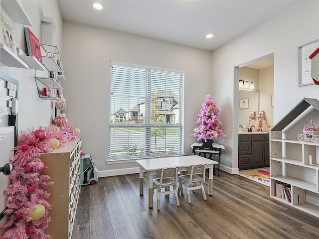 playroom featuring dark wood-type flooring, recessed lighting, and baseboards