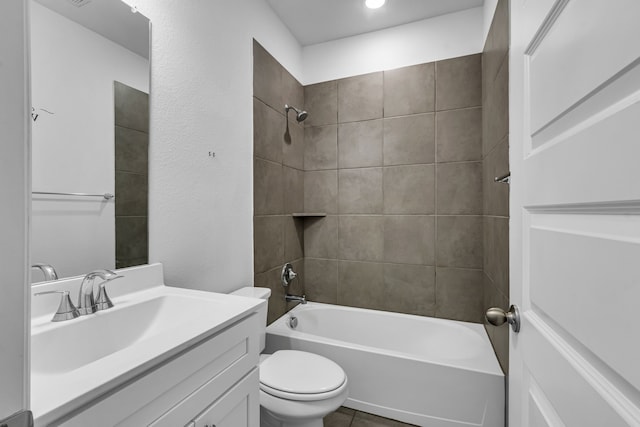 bathroom featuring toilet, vanity, and bathing tub / shower combination