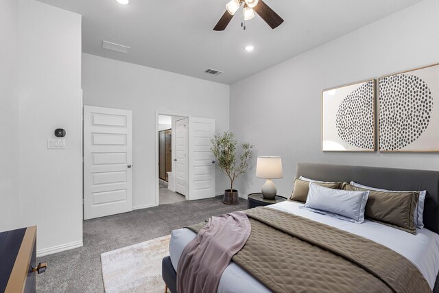 carpeted bedroom featuring baseboards, visible vents, a ceiling fan, ensuite bathroom, and recessed lighting