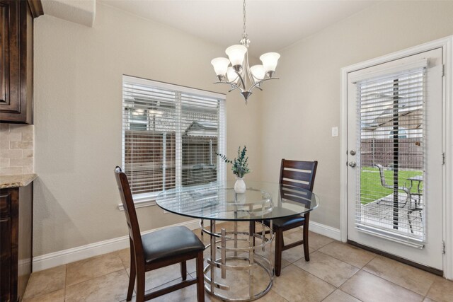 kitchen featuring visible vents, light stone countertops, stainless steel appliances, dark brown cabinets, and a sink