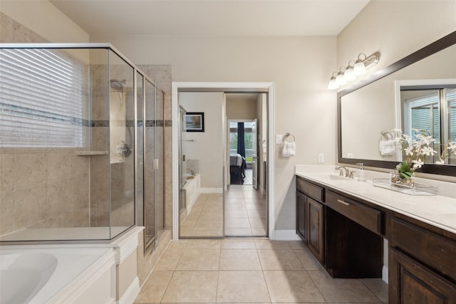 ensuite bathroom featuring a garden tub, a shower stall, ensuite bathroom, and vanity