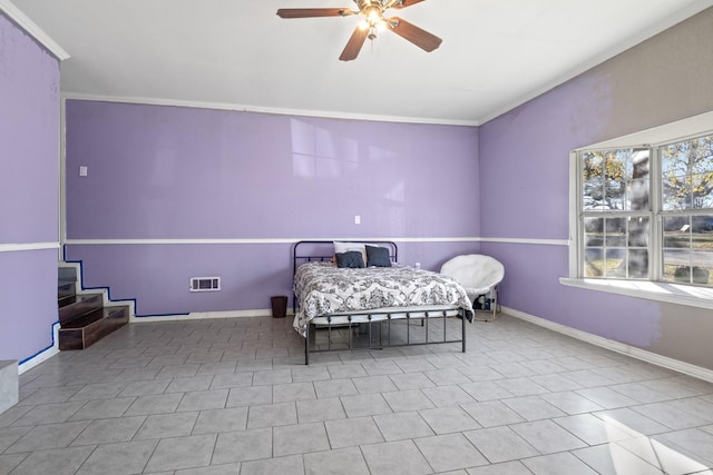 unfurnished bedroom with visible vents, baseboards, and a ceiling fan