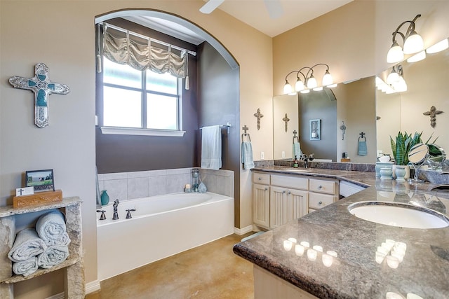 full bath with double vanity, a sink, and a bath